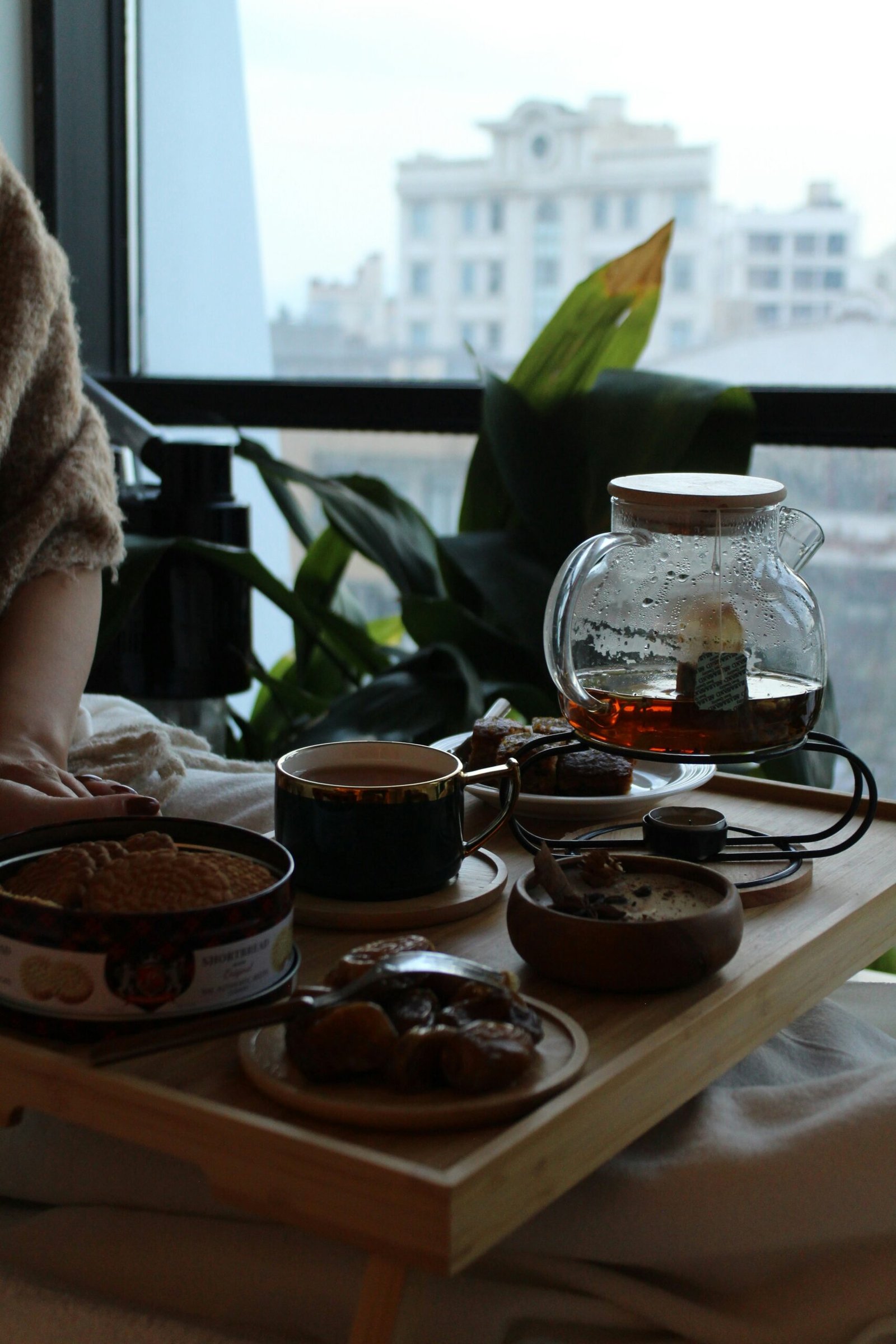 A woman sitting at a table with a tray of food